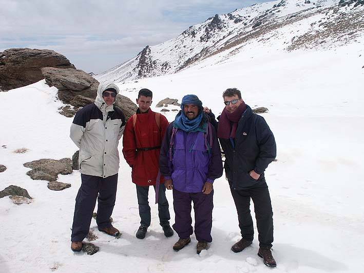 Andy (on right) with friends and guide on the col near the summit of Mount Tinergwet